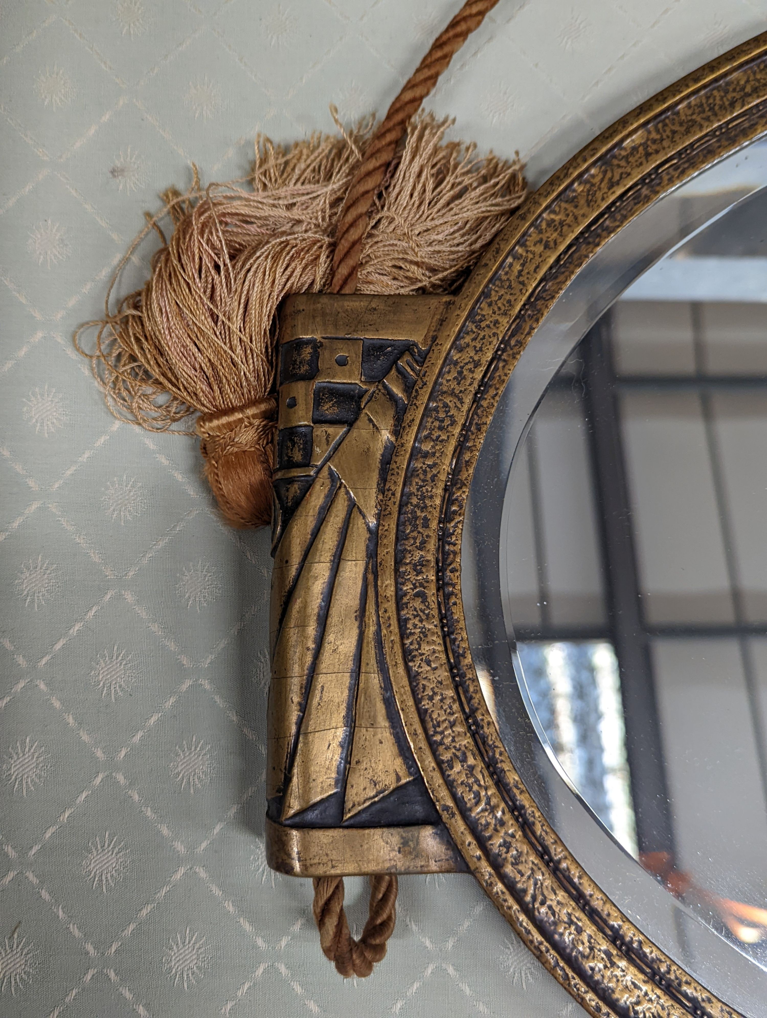 An Art Deco style oval wall mirror, width 74cm, height 43cm